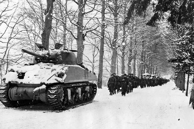 Sherman tanks advance during the Battle of the Bulge