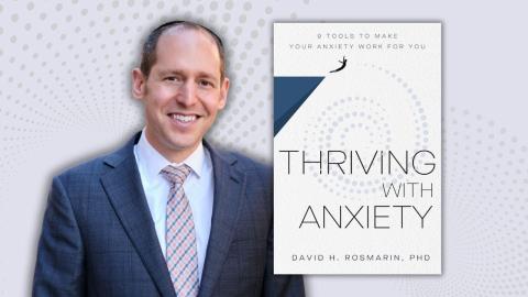 Dr. David H. Rosmarin with his book "Thriving With Anxiety".