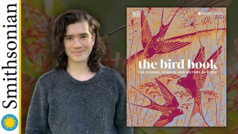 Smithsonian Biologist Jay Falk with the book titled "The Bird Book: The Stories, Science, and History of Birds".